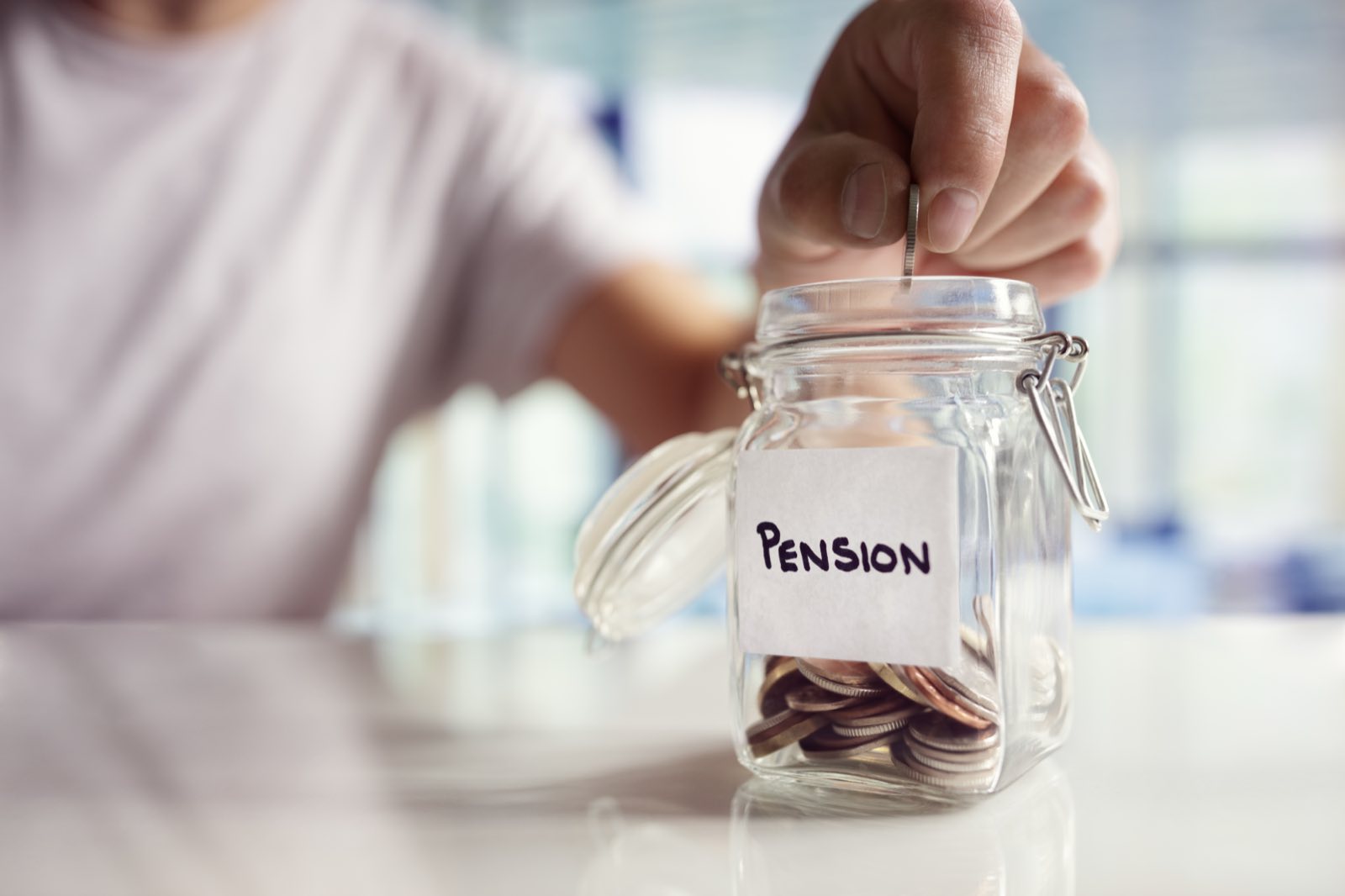 Coins in a jar labelled pension